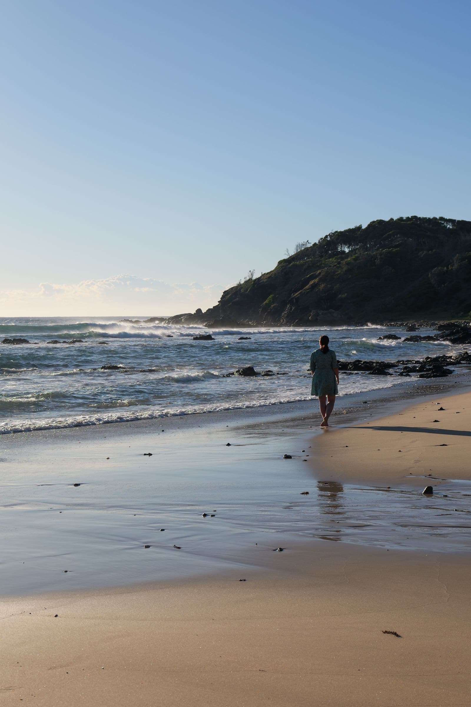 A walker on the sand at Shelly Beach, Port Macquarie