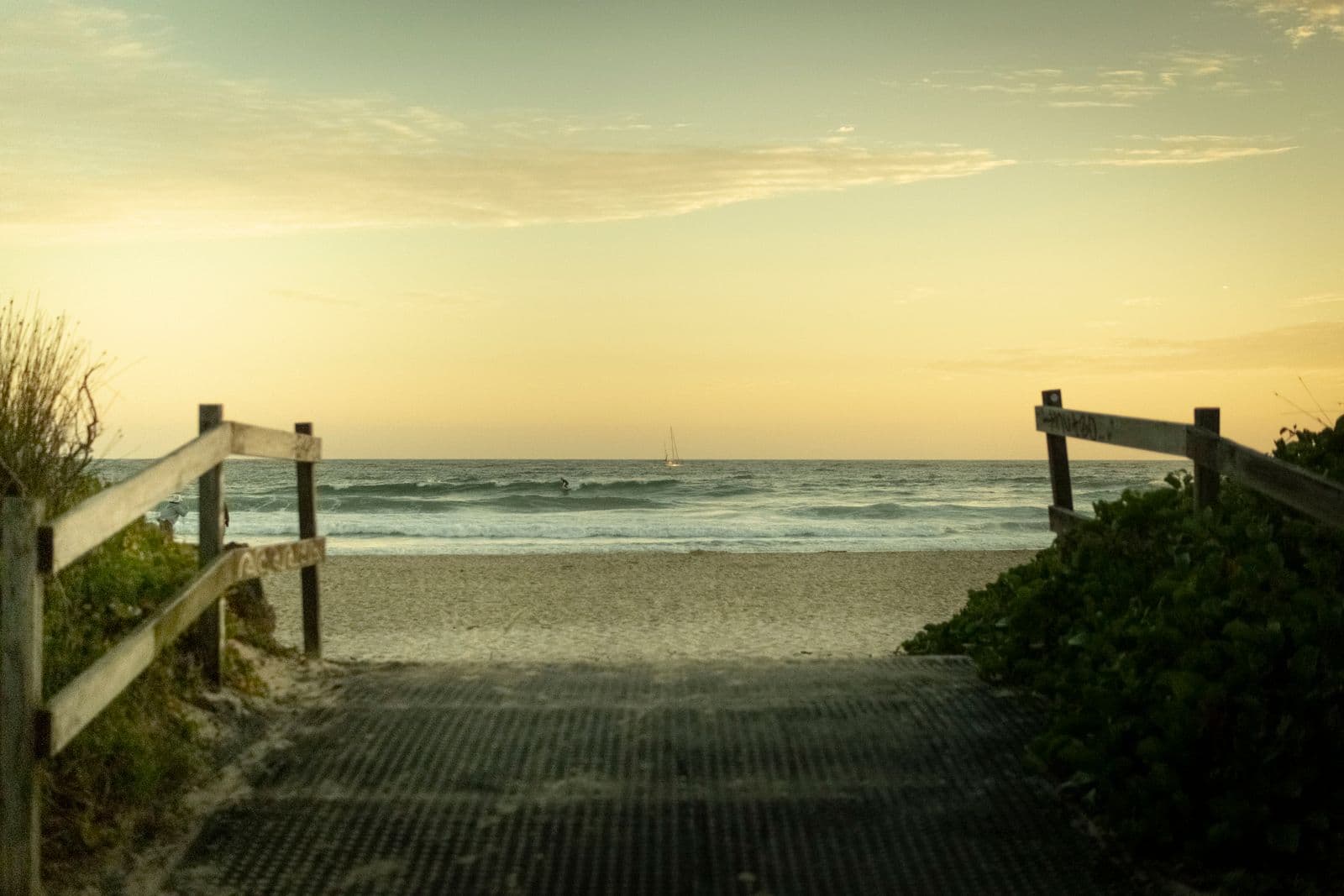Sandy path leading down to the ocean at sunrise in Port Macquarie